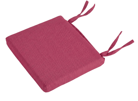 Ein quadratisches, dickes, rosafarbenes KraftKids Sitzkissen für Stühle Leinen mit zwei Paar Stoffbändern auf einer Seite - ideal zum Befestigen an Stühlen als Sitzkissen Kinderstuhl oder für zusätzlichen Komfort im Alltag.